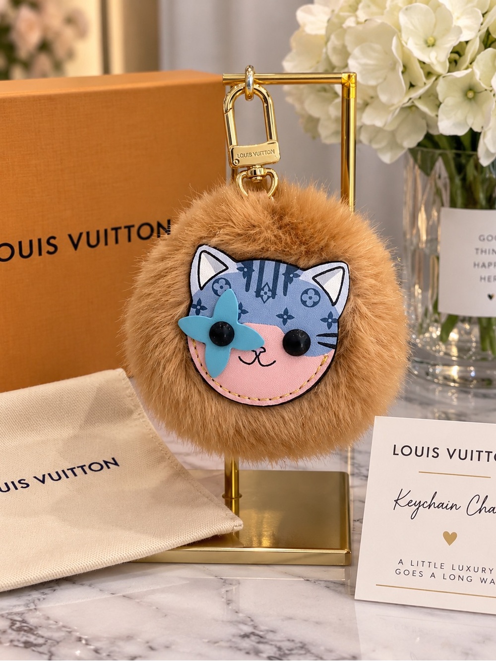 Brown Faux Fur Cat Pom Keychain with Blue Flower Accent